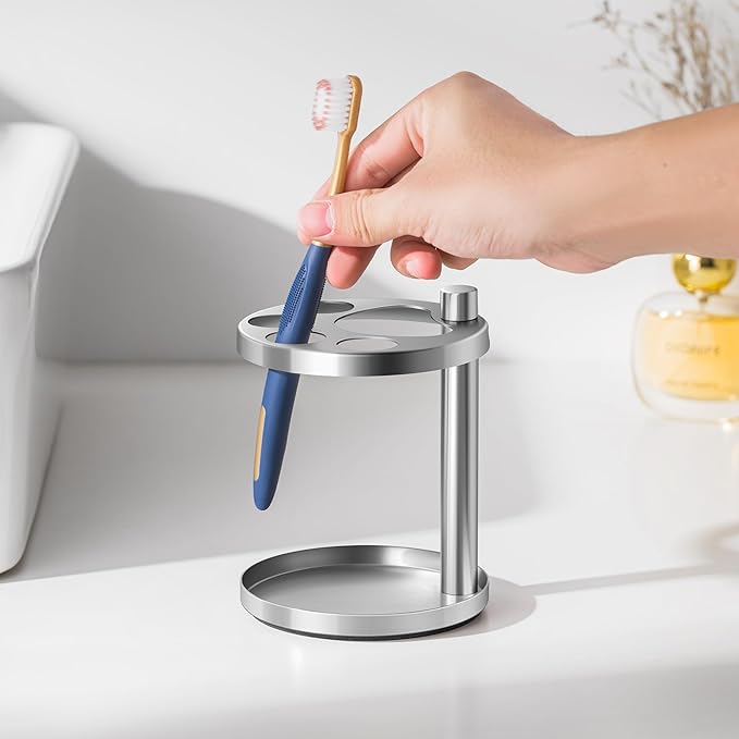 Stainless Toothbrush Holder Stand for Bathroom: Stainless Steel Ventilated Organizer with Slots for Electric Toothbrushes, Toothpaste, Razors & Small Comb, Unique Footprint Base Design, Brushed Silver